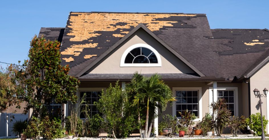 House with roof damaged by storm.