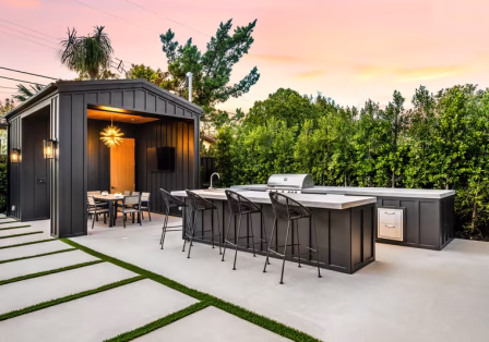 Custom outdoor kitchen with built-in grill and granite countertops in New Orleans