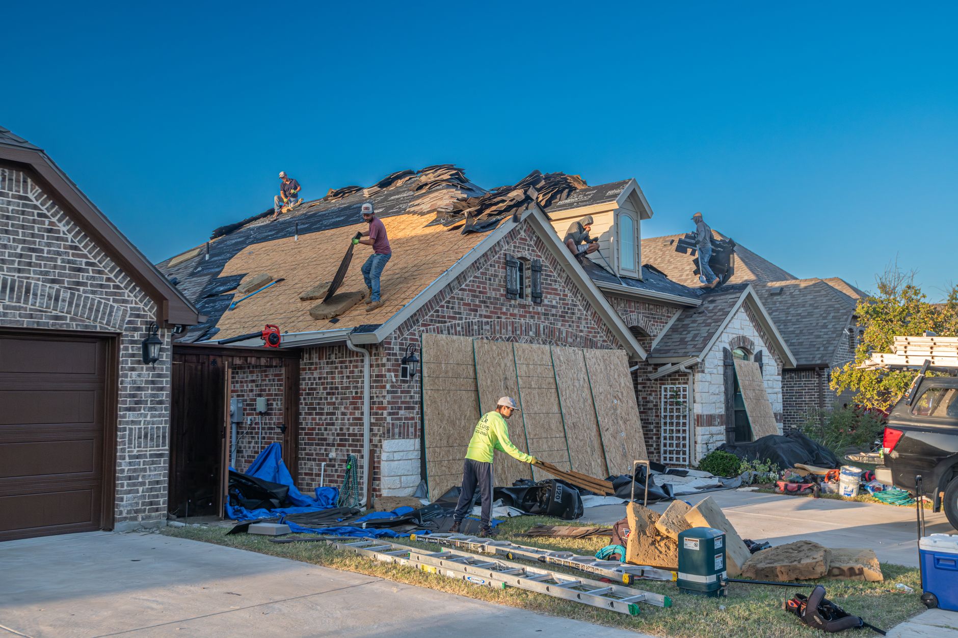 roofer replacing shingles New Orleans renovation
